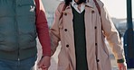 Senior asian couple, holding hands or walking in Japanese city for holiday, vacation or retirement break. Handheld view, happy smile or elderly portrait man or love woman talking and bonding in trust