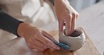 Zoom of creative clay pottery hands with ceramic mold workshop for art, sculpting or manufacturing design class. Learning, startup or working with ceramics or hand craft in studio or small business