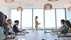 Business woman, ceo leader in meeting and conference room giving a corporate brief presentation at the office. Confident businesswoman with company leadership, strategy and employee management skills