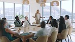 Leader, woman and finance presentation in meeting, documents or charts on table in office. Marketing, data and analytics of female ceo, boss or entrepreneur speaker in discussion with corporate team