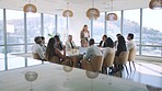 Business woman talking in a marketing presentation with her team during a planning meeting in a office boardroom. Corporate people talk, discuss and communication marketing paper or document at work