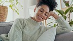 Relax, happy and woman on a phone call with a smile on a sofa in the living room of her modern home. Happiness, rest and lady from Mexico sitting on a couch in her lounge while on mobile conversation