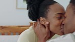 Phone, bed and silly couple kiss while relax at home, bonding or enjoy quality time together. Love, bedroom and playful black woman with man filming girlfriend for relationship memory or social media