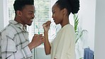 Dance, fun and love with a black couple in the bathroom, singing and playing during oral hygiene. Health, teeth and cleaning with a young man and woman practicing dental care together in their home