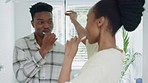 Dance, brushing teeth and black couple in bathroom home, carefree and having fun. Romance, dental health and love, happy man and woman dancing, bonding and hugging enjoying quality time together.