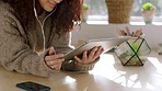 Digital tablet, happy woman and streaming a movie on a website with a mobile device and earphones. Girl watching a video on the internet or social media with technology in her modern apartment.