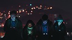 Night, rooftop and gaming friends with smartphone for online video game mobile app with bokeh city lights in the dark. Happy social media, gen z group of people with 5g cellphone networking web chat