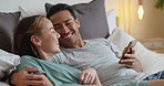 Asian couple, phone or laughing while bonding in house, home or relax hotel bedroom with funny meme, internet joke or comic news. Smile, happy or love man and woman on social media mobile technology