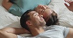 Happy couple, bedroom and talking while lying on bed for love and marriage bonding happiness in comfy home. Asian man and woman joke and relax in romantic hotel together in morning from above