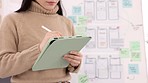 Woman, tablet and ui ux design with the developer being creative for mobile app project with a pen in office. Female planning, web design and development of wireframe on storyboard for website idea