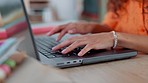 Hands, typing and laptop with a black woman designer working in her office on a report or online order. Ecommerce, computer and creative with a young female freelance blogger at work on an article