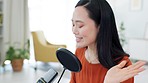 Digital, microphone and influencer live streaming on a podcast talking on social media trending news to online audience. Content marketing, communication and Asian woman speaking of content creation