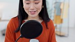 Asian woman, microphone and podcast, influencer and presenter talking to online audience. Host, podcaster and happy female from Japan on mic for radio talk show, live streaming audio or broadcast.

