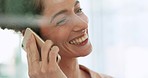 Business woman, phone call and face laughing with smile in friendly conversation at the workplace. Happy female listening to funny joke in joyful laugh for communication on mobile smartphone at work