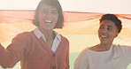 Lesbian couple, women or pride flag on beach date in trust, bond or security for gay equality, empowerment or freedom. Portrait, smile or happy lgbtq girlfriends or Colombia people and rainbow fabric