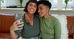 Phone, selfie and lesbian couple relax on a sofa, picture , bonding and having fun in a living room. Love, happy and women enjoying quality time together, photo and their relationship in their home