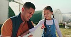 Farm, child and father talking with a chicken, learning about agriculture and sustainability together in the countryside. Playful, happy kid with smile and dad with a bird on farming land in nature