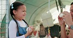 Chicken farmer, man or girl with eggs in playful bond, fun or comic game on nature environment, sustainability agriculture or countryside field. Smile, happy child or laughing father playing on farm