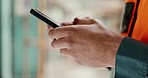 Social media, internet and hands of an architect with a phone for communication, construction website and building app. Construction worker working on a mobile, typing on web and doing search on site