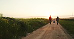 Man, woman or child holding hands on farm and sunset walking on nature environment path, agriculture dirt road or countryside soil. Farming family, girl or parents bonding on sustainability landscape