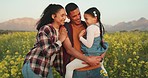 Family, farm and a couple with child in field of flowers, happy, sustainable and together. Man, woman and kid, sustainability  countryside farmer in nature farming with trust and support for future.