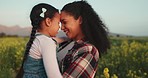 Love, happy mom and child funny bonding laugh together outdoors on farm flower field. Young girl and mother affection bond, childhood care and beautiful smile family connection moment in nature