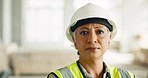 Woman, serious face and construction worker, engineer at work site and business, building trade industry portrait. Mature person,  safety helmet and professional, engineering and construction job. 