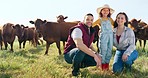 Farm, family and cattle with a girl, mother and father in a field outdoor on a ranch with cows. Agriculture, sustainability and love with a man, woman and daughter working in farming for growth