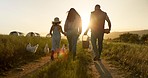 Farmer family, farm and bonding mother, father and girl on environment or countryside sustainability agriculture field. People and kid walking on an agriculture poultry or chicken field during sunset
