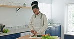 Black couple cooking, love and vegetable, kiss and taste food in kitchen, bonding with chef skill and relationship growth. Black woman, man and eating, preparing meal for health and nutrition.