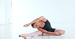 Ballet, dancer and dance stretch of a ballerina woman from India ready for dancing in a studio. Stretching happy person about to start creative training, exercise and workout in a white room