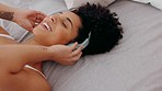 Black woman, headphones and music, listening and singing, dance and fun, audio and song streaming while in bedroom. Young, carefree and radio with wireless headphone, bluetooth, smile and happy.