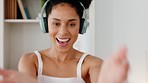 Black woman, headphones and dance while happy, smile and relax for break, vacation and song in home. Portrait, young female and girl have fun, dancing and streaming music with headset to listen audio