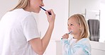 Development, mother and girl in bathroom with brush for teeth doing bonding, embrace and loving together. Female parent, lady and kid or child brushing teeth, dental hygiene and child growth at home.