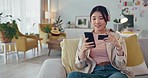 Japan, phone or woman with credit card payment on sofa for online shopping, fintech or ecommerce app at home. Happy, relax and girl with smile for digital banking, website store purchase or trading