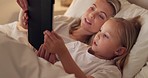 Tablet, bed and relax with a girl and mother watching or streaming series on a subscription service while lying in a bedroom. Family, love and kids with a woman and daughter bonding together at home