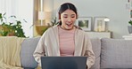 Woman, headphones and laptop with winner on home sofa to celebrate and excited about winning online competition. Female happy about website results, news and gaming for auction or investment in Korea