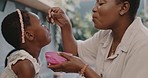 Breakfast, mother and child eating porridge in the kitchen of their in the morning. Food, family and black woman, mom and mama feeding her girl baby with nutrition for lunch or dinner at home