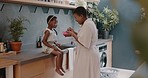 Black family, mother and girl feeding and eating in a home kitchen to show child care and love. Hungry kid and mama with happiness bonding together with quality family time at a house with a smile