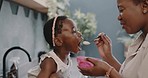 Mother feeding child, food and nutrition, eating and happy, porridge in the kitchen with childhood development and parenting. Black woman with girl kid, hungry and healthy diet, growth and health.