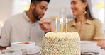 Cake, anniversary or birthday, couple celebrate and romantic together, kiss and love during dinner date. Young, man and woman, relationship growth and spending quality time, food and dessert to enjoy