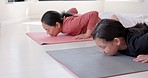 Yoga, pilates and asian mother and child talking while doing workout, training or fitness exercise together on living room floor. Love, Japanese family and mom and girl stretching for wellness health