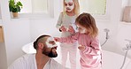 Skincare, father and bonding with children or little girls in home bathroom. Fun, loving and caring dad bond with daughter siblings while applying face mask for smooth, glowing and healthy skin