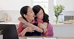 Hug, child and mother working with a laptop and report with love, care and support from a girl in a house. Remote, happy and Asian mom with affection, communication and hugging from kid with work