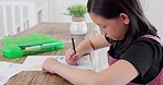 Girl, sketch and creative while drawing in paper for homework, learning or fun in home. Child, pencil and picture on page while busy with homeschool, color art or artistic hobby on table in house