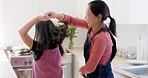 Music, dance and mother with girl in a kitchen, happy and dancing, bond and having fun in their home together. Family, radio and asian mom with daughter dancing, freedom and energy in house in China