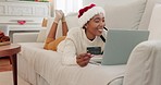 Woman, laptop or credit card in christmas ecommerce, online shopping or e commerce retail on relax house or home living room sofa. Smile, happy or festive customer on technology fintech or gift store