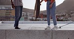 Skateboard, friends and city with a man and woman skating on a rooftop outdoor during the day. Sport, exercise and summer with a male and female training as a street skater in an urban town