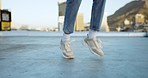 Shoes, dance and music with a woman on a rooftop in the city, feeling carefree and excited about freedom. Feet, dancing and movement with a female dancer outdoor on an urban background in the day