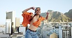 Dance, freedom and happy woman in city dancing, performance and urban talent in South Africa. Gen z, creative and young, carefree and fun female hip hop dancer in rhythm movement on street outdoors

